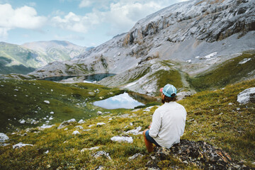 Wall Mural - man enjoying lakes view in mountains travel outdoor hiking solo active summer vacations healthy life