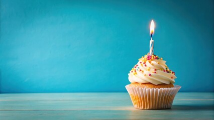 Wall Mural - A single candle on a colorful birthday cupcake with a creamy white frosting and sprinkles, set against a bright blue background with a subtle gradient effect, candle lighting, cupcake centerpiece