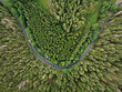 © AmazingAerialAgency - Aerial view of a serene highway surrounded by lush forest and trees, Nova Ves, Czech Republic.