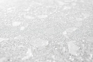 Poster - Close-up of a white glitter texture, with a bright silver shimmer on a clean grey background. 