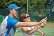 © fStop - Tennis teacher instructing a woman