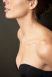 © fStop - Close up profile of a young woman wearing a strapless black bra