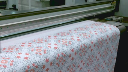 Poster - Industrial printing on woven material a modern digital inkjet printer applies a pattern to a fabric or paper