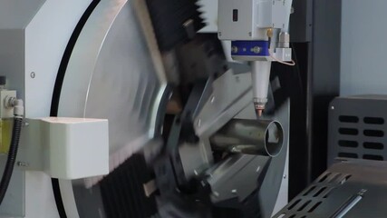 Poster - Close up scene the fiber laser cutting machine cutting  machine cut the stainless steel tube. The hi-technology sheet metal manufacturing process by laser cutting machine. technical concept background