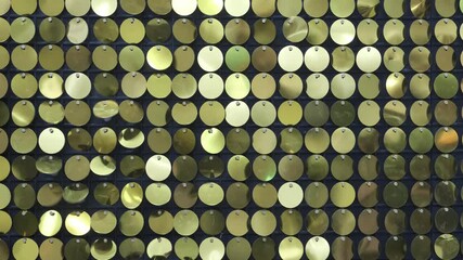 Aufkleber - A blurry image of gold and green dots. The dots are scattered all over the image, creating a sense of movement and energy. The image is abstract and has a dreamy, ethereal quality to it