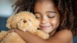 © Design Depot - Young girl embraces her favorite stuffed animal with joy and warmth