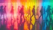 © saleem - Colorful silhouettes of people walking through a vibrant, illuminated space in an urban setting during an evening event