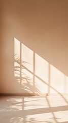 Fototapete - Sunlight streaming through a window, casting shadows of the window frame and a plant onto a beige wall and wooden floor in an empty room, creating a peaceful and minimalist atmosphere