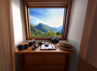Poster - A wooden dresser holds travel gear near a window showcasing a breathtaking mountain vista.  Sunlight streams in, illuminating the scene.