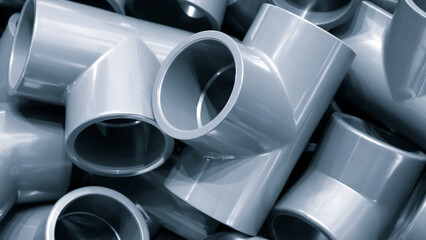 Poster - Grey pvc plumbing pipes corners background closeup
