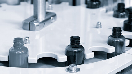 Poster - pharmaceutical industry, medicine pills are filling in the  bottle on production line machine conveyor at the medical factory. selective focus.