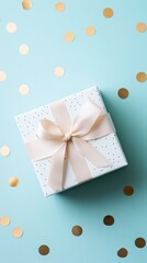 Poster - White gift box with beige ribbon and golden confetti on a pastel blue background creating a festive and celebratory atmosphere, perfect for special occasions and celebrations