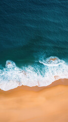 Wall Mural - Aerial view of golden sandy coastline meeting turquoise ocean waves, creating serene and tranquil scene