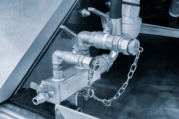 Poster - A chain is wrapped around a pipe, which is connected to a valve. The chain is locked, preventing the valve from being turned on