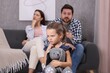 © New Africa - Resentful little girl with toy and her parents at home. Family dispute