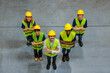 © bernardbodo - Warehouse workers posing for a photo with their arms crossed