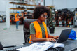© bernardbodo - Female industrial engineer working on laptop in factory