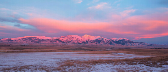 Aufkleber - Stunning sunset over snow-covered mountains with vibrant pink and orange hues