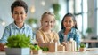 © Vilaysack - Three children smile while showcasing their wooden building models in a bright, modern environment filled with greenery.