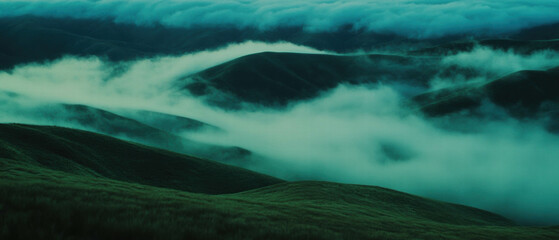 Poster - Misty rolling hills shrouded in fog create an atmospheric landscape at dawn