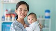 © Vilaysack - A smiling woman holds a baby in a bright, inviting room filled with soft colors and shelves of supplies.