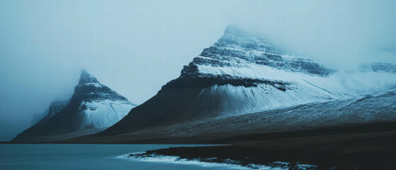 Poster - Majestic snow covered mountain peaks with glaciers under cloudy skies at dawn