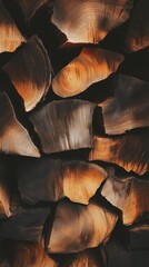 Poster - Close up view of stacked firewood logs showcasing the natural beauty and texture of wood, creating a cozy and rustic background perfect for evoking the warmth of winter