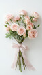 © AISTEL - Delicate airy bouquet with pastel pink roses and ribbon on pure white background, fine art photography