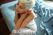 © Marko Geber - Senior woman relaxing in bed with peaceful expression