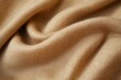 © jambulart - Soft, tan fabric with gentle folds.