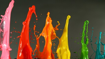 Poster - Acrylic colors splashing on black background. Abstract colored spectrum background.