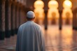 © ahmed - Ramadan Muslim Man in Traditional Thobe Walking Mosque Interior Golden Hour Light