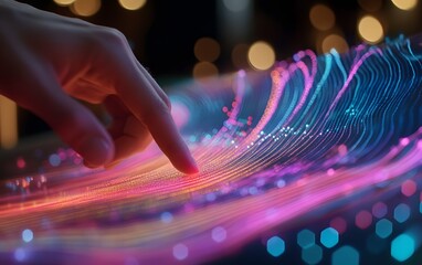 Poster - A close-up view of a hand interacting with a vibrant, colorful wave of digital light patterns, symbolizing innovation and connectivity in a modern technology landscape.
