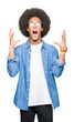 © Krakenimages.com - Young african american man with afro hair wearing glasses crazy and mad shouting and yelling with aggressive expression and arms raised. Frustration concept.