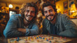 © Anastasia - Gay couple laughing together while playing a board game at home, sitting cross-legged on the floor, bright lighting, contrast and smooth lines