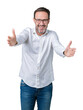 © Krakenimages.com - Handsome middle age elegant senior business man wearing glasses over isolated background looking at the camera smiling with open arms for hug. Cheerful expression embracing happiness.