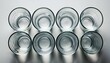 © Genevieve - empty glasses arranged symmetrically on white background sense of order and simplicity