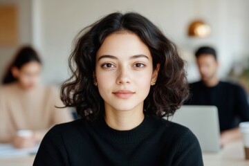 Aufkleber - Modern Coworking Space Young Professional Woman in Focus Amid Collaborative Teamwork