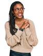 © Krakenimages.com - African american woman wearing casual clothes laughing nervous and excited with hands on chin looking to the side
