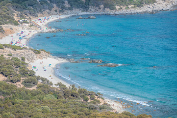 Aerial view of the beautiful beach of Porto Sa Ruxi in Sardinia with white sand and transparent blue and turquoise water