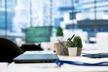 Poster - Focus on laptop in empty company financial department with stock portfolio on computer in blurry background. Close up on notebook in workspace with live index indices on PC screen