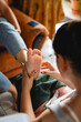 © Leonardo Borges/Stocksy - Woman massaging the feet of an unrecognizable person
