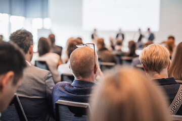 Wall Mural - Interview and round table discussion at business convention and presentation. Audience at the conference hall. Business and entrepreneurship symposium.