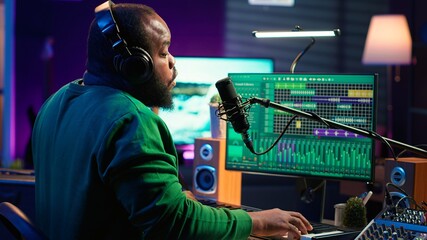 Aufkleber - Young artist playing piano keys and singing song on microphone, composing his new music and mixing the tracks on digital interface. Producer technician composing melody with gear. Camera A.