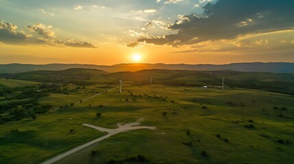 Wall Mural - Sunset over Green Hills with Wind Turbines