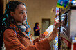© Jovo Jovanovic/Stocksy - Serious woman buying product in supermarket
