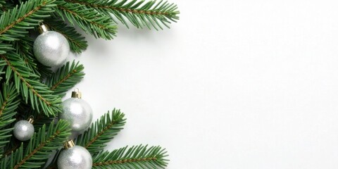 Poster - Silver ornaments and evergreen boughs on white background ideal for winter holiday greeting card design