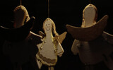 Three levitating wooden Angels on the ropes