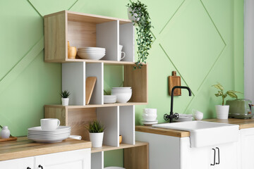 Wall Mural - Interior of stylish kitchen with clean dishes on shelves and counters