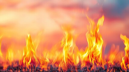 Poster - Fire abstract background concept. Vivid flames dance against a colorful sky, showcasing the beauty of fire in nature.